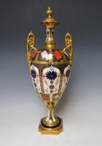 A ROYAL CROWN DERBY IMARI PATTERN TWIN HANDLED OVOID PEDESTAL VASE AND COVER, pattern no. 1128, H 42
