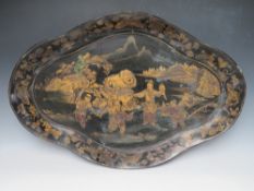 A LARGE SHAPED PAPIER MACHE TRAY, decorated with gilt painted Oriental figures in a landscape,, W 77