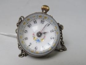 A 19TH CENTURY BALL PENDANT WATCH, with white metal casing and white metal chain, dial Dia. 2.5 cm
