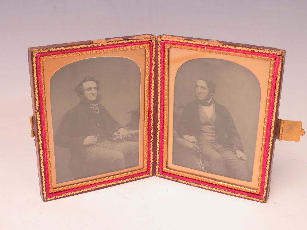 A 19TH CENTURY CASED AMBROTYPE DOUBLE PORTRAIT OF TWO SEATED GENTLEMEN, image 9 x 6.5 cm, case 12