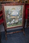 A 19TH CENTURY CARVED OAK FIRESCREEN WITH INSET WATERCOLOUR, carved with trailing vine leaves and