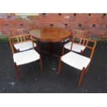 A DRYLUND FLIP FLAP LOTUS ROSEWOOD DINING TABLE AND SIX CHAIRS, the circular table having four
