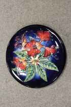 A MOORCROFT CIRCULAR CHARGER DECORATED IN THE SIMEON PATTERN, impressed marks and dated '99, Dia.