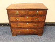 A 19TH CENTURY OAK AND MAHOGANY CROSSBANDED CHEST OF DRAWERS, having two short above three longer