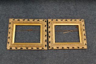 A PAIR OF 19TH CENTURY GOLD DECORATIVE PIERCED FRAMES, frame W 5 cm, slip rebate 20 x 28 cm, frame
