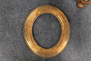 A 19TH CENTURY DECORATIVE OVAL GOLD FRAME, frame W 7.5 cm, site size 30 x 24 cm, rebate 31.5 x 28