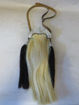 A HORSE HAIR SPORRAN WITH CELTIC EMBELLISHMENT