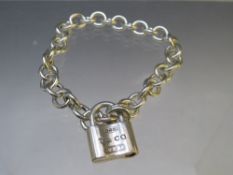 A TIFFANY & Co. 925 SILVER LINK BRACELET WITH PADLOCK FASTENER, approximate weight 23.85 g