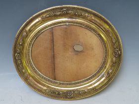 A 19TH CENTURY OVAL DECORATIVE GILT FRAME, glazed, frame W 5 cm, rebate 22 x 18 cm