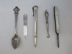 A WHITE METAL ROLEX ADVERTISING SPOON, together with a hallmarked silver bookmark, a small fruit