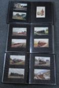 THREE ALBUMS OF VINTAGE POSTCARDS OF VARYING SUBJECTS & PLACES, to include a large amount of railway
