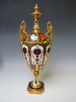 A ROYAL CROWN DERBY IMARI PATTERN TWIN HANDLED OVOID PEDESTAL VASE AND COVER, pattern no. 1128, H 42