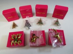 A COLLECTION OF SEVEN BUTLER AND WILSON CHRISTMAS THEMED BROOCHES, comprising four assorted