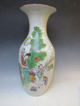A LARGE ORIENTAL BALUSTER VASE, with figures playing games in a landscape, H 54 cm