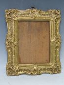 A 19TH CENTURY DECORATIVE GOLD FRAME, glazed, frame W 5 cm, rebate 18 x 14 cm