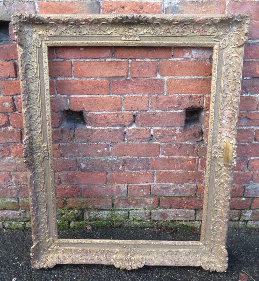 A 19TH CENTURY GILT RECTANGULAR PICTURE FRAME, with acanthus moulded detail throughout, slip