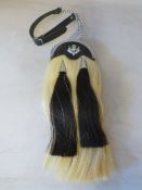 A HORSE HAIR SPORRAN WITH SINGLE THISTLE BADGE