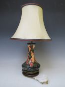 A MODERN MOORCROFT SWEET BRIAR PATTERN TABLE LAMP WITH SHADE, of globe and shaft form, on a turned
