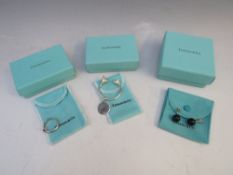 THREE ITEMS OF TIFFANY & Co. 925 SILVER JEWELLERY, comprising a gemset silver ring - size N, a