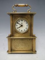 A SMALL BRASS CASED MUSICAL ALARM CLOCK, playing Brahms 'Lullaby For Babies'