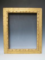 A 19TH CENTURY ART AND CRAFTS GOLD FRAME, with acorn leaf design, frame W 9 cm, rebate 59.5 x 47.5