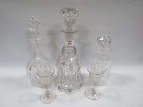 A GEORGIAN GLASS DECANTER TOGETHER WITH LATER EXAMPLES, also with two antique glasses (5)