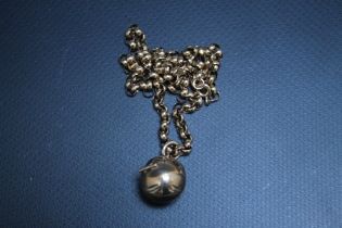 A SILVER GILT MASONIC BALL BY F BROS, suspended upon a belcher chain stamped 375, approx weight of
