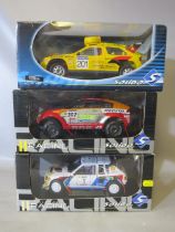 THREE BOXED SOLIDO 1:18 SCALE RALLY CARS, Citroen ZX Rally 1992, Peugeot 205 1986, Mitsubishi Pajero