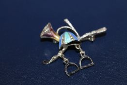 A SILVER MARCASITE AND ENAMEL HUNTING THEMED BROOCH, W 4.75 cm