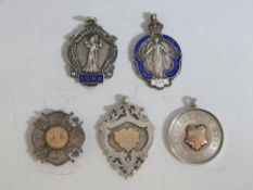 FOUR VINTAGE HALLMARKED SILVER FOBS, two with enamelling, together with a hallmarked silver and