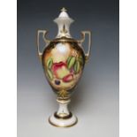 A SPODE HAND PAINTED TWIN HANDLED VASE AND COVER SIGNED 'KEN YATES'. decorated with fruit, H 31.5