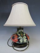 A MODERN MOORCROFT POPPY TABLE LAMP WITH SHADE, designed by Rachel Bishop, of bulbous form,on a