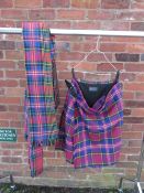 A TARTAN MILITARY KILT TOGETHER WITH A TARTAN PIPERS PLAID