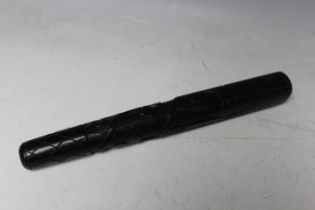 A VINTAGE IRISH CARVED BOG OAK TRUNCHEON, decorated with shamrocks, L 30 cm