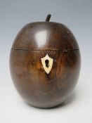 A 20TH CENTURY TEA CADDY IN THE FORM OF A PIECE OF FRUIT, overall H 14 cm