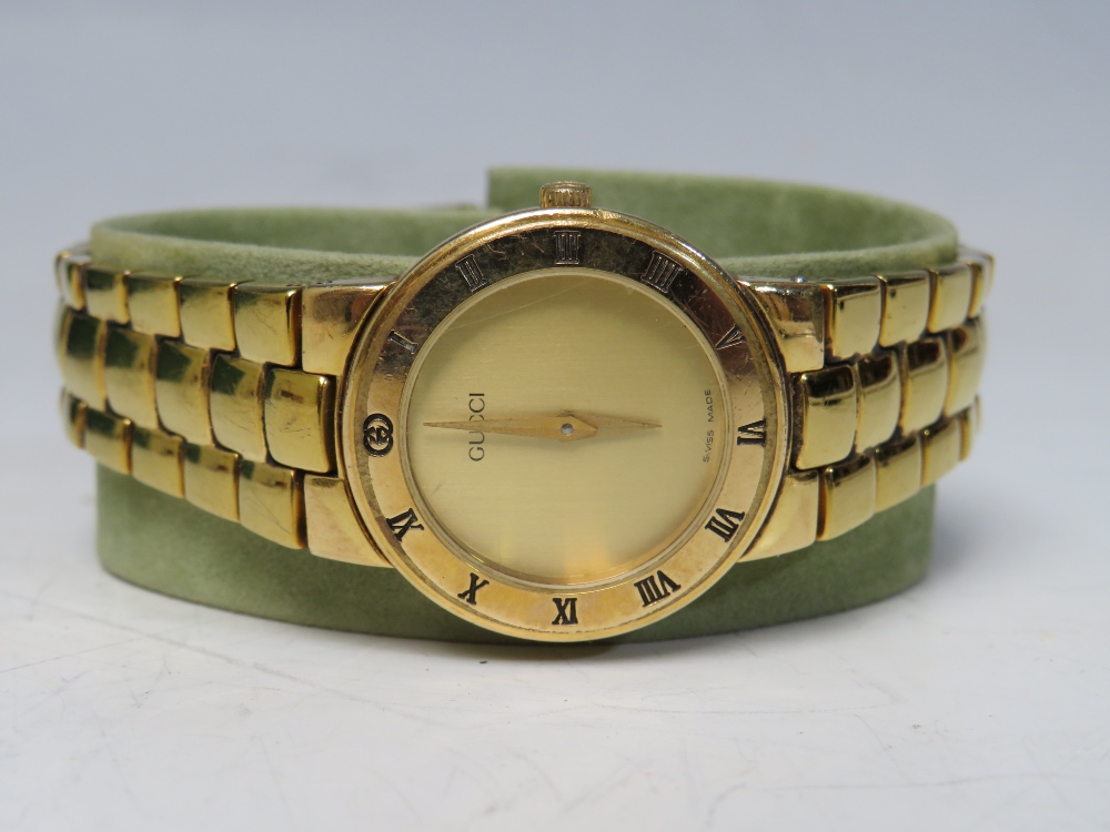 A 1980 / 90'S LADIES GUCCI GOLD PLATED WRISTWATCH, with champagne coloured dial and Roman Numerals - Image 2 of 4