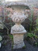AN UNUSUAL FIBREGLASS ? CLAD TWIN HANDLED BALUSTER URN ON STAND, H 145 cm