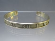 A TIFFANY & Co. 925 SILVER ATLAS ROMAN NUMERALS CUFF BANGLE, approximate weight 22 g