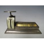 AN EARLY 20TH CENTURY PLATED COMBINATION STAMP BOX AND LETTER SCALE, scale H 8 cm, overall L 15 cm