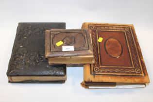 THREE PARTIAL FILLED ANTIQUE PHOTOGRAPH ALBUMS