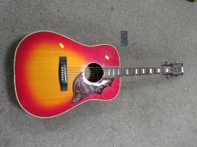 A TENADA FW"650 CHERRY SUNBURST ACOUSTIC GUITAR WITH MOTHER OF PEARL INLAY