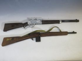A CHILDS ARMY CADET TRAINING RIFLE BY PARIS MANUFACTURING Co., together with a Rustler Laramie