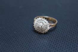 A HALLMARKED 9 CARAT GOLD DIAMOND CLUSTER RING, set with an estimated half carat of diamonds, approx