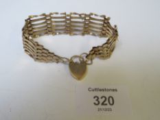 A 9CT GOLD SIX BAR GATE BRACELET, WITH HEART PADLOCK CLASP A/F, APPROX WEIGHT 13.69 G