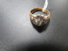 AN 18CT DIAMOND RING SET WITH AN OVAL - POSSIBLY OLD CUT - CENTRAL DIAMOND OF AN ESTIMATED 0.65