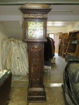 A HEAVILY CARVED OAK ANTIQUE LONGCASE CLOCK WITH EIGHT DAY MOVEMENT PENDULUM AND TWO WEIGHTS H-218 C