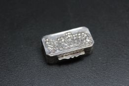 A MODERN CONTINENTAL STYLE SILVER PILL BOX, with import hallmarks, decorated with typical