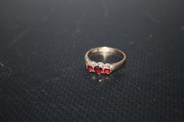 A HALLMARKED 9 CARAT GOLD THREE STONE GARNET RING, approx weight 1.7g, ring size k 1/2