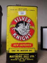 A VINTAGE SILVER KNIGHT MOTOR OIL CAN