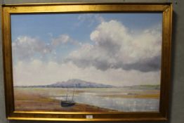 A GILT FRAMED OIL ON CANVAS OF AN ESTUARY SCENE ENTITLED HOLYHEAD MOUNTAIN BY LIONEL ROUSE SIGNED